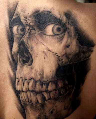 Evil horror tattoo on back