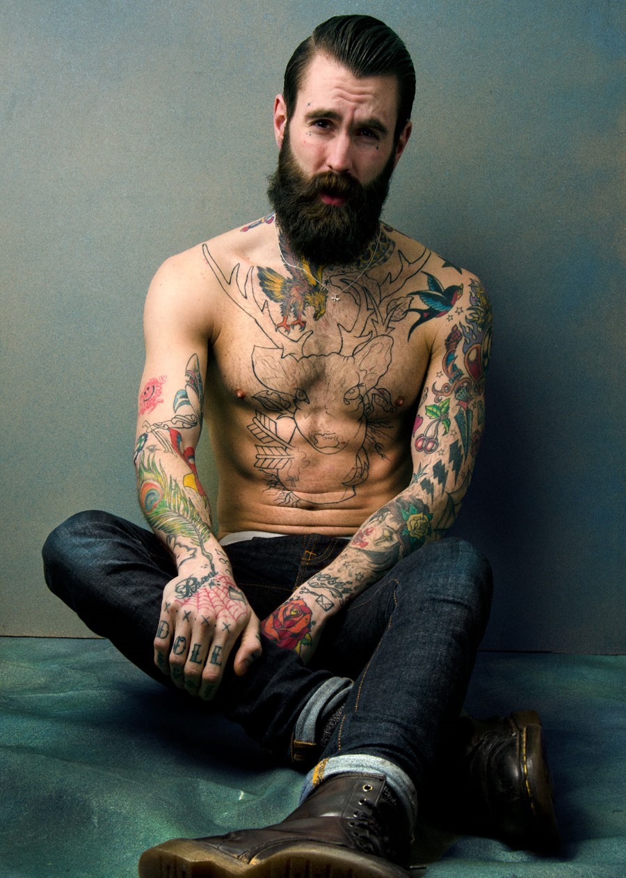 Colored tattoos on man both arms