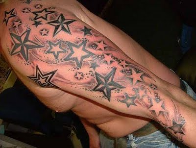 Awesome nautical star tattoos on left sleeve