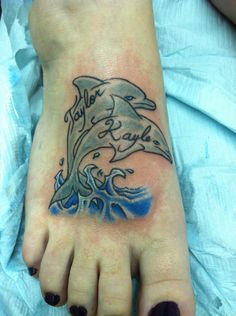 Best Dolphin Tattoo on lower foot Design 2015