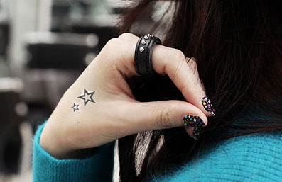 Girl hand star tattoo 2015