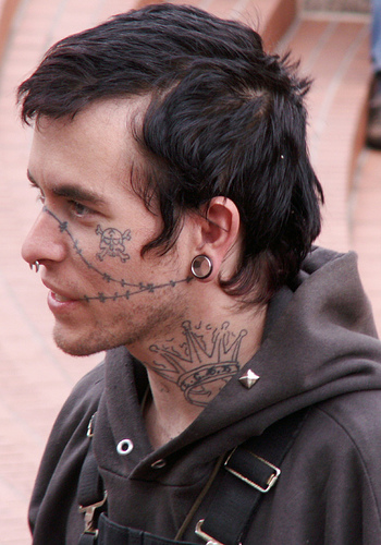 Pirate skull and wire face tattoo