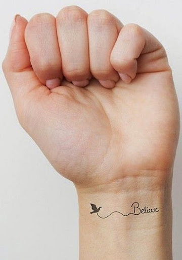 cute flying bird tattoo on wrist